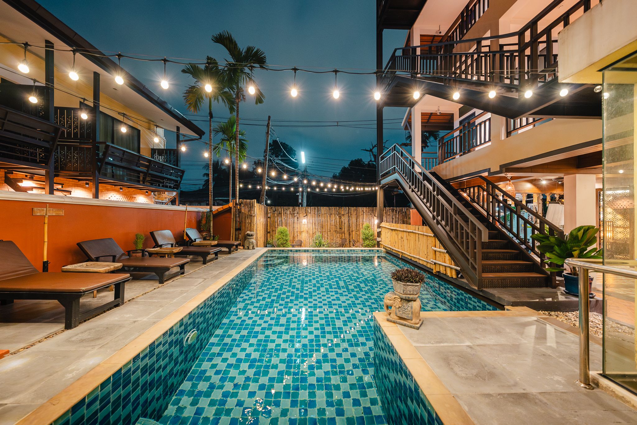 Nighttime swimming pool atmosphere in a Chiang Mai hotel